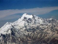 
The flight from Islamabad to Skardu continues to fly around Nanga Parbat with Hermann Buhls route of first ascent becoming perfectly visible. Rakhiot Peak leads up to the Silver Saddle between the Nanga Parbat Southeast and East Peaks, and up to the summit with the North Peaks on the right.
